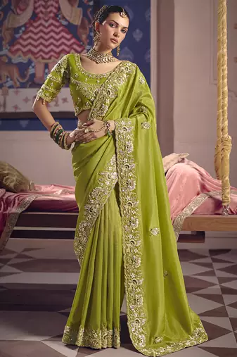 Parrot green silk embroidered wedding wear saree
