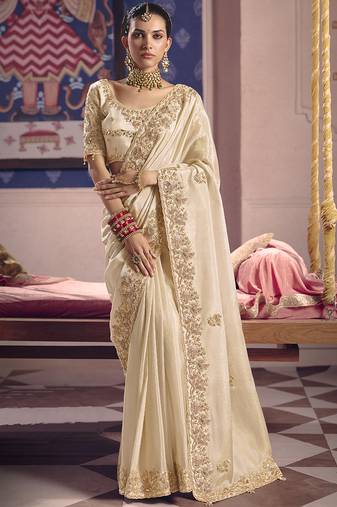 Cream silk embroidered wedding wear saree