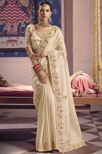 Cream silk embroidered wedding wear saree