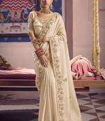 cream embroidered silk wedding saree