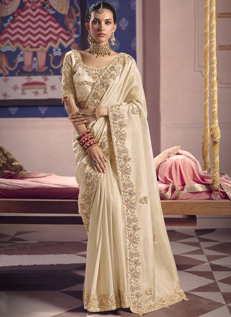 Cream silk embroidered wedding wear saree
