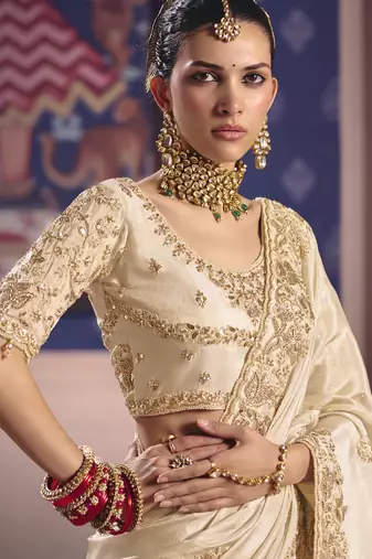 cream embroidered silk wedding saree