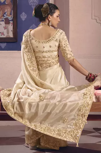 cream embroidered silk wedding saree
