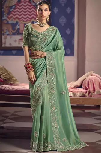 Dark green silk embroidered wedding wear saree