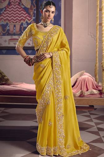 Yellow silk embroidered wedding wear saree