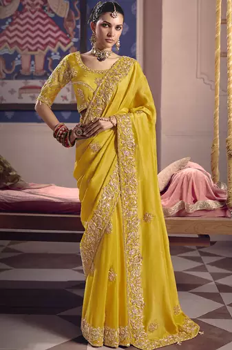 Yellow silk embroidered wedding wear saree