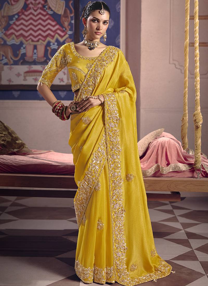 Yellow silk embroidered wedding wear saree