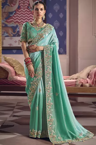 Turquoise silk embroidered wedding wear saree
