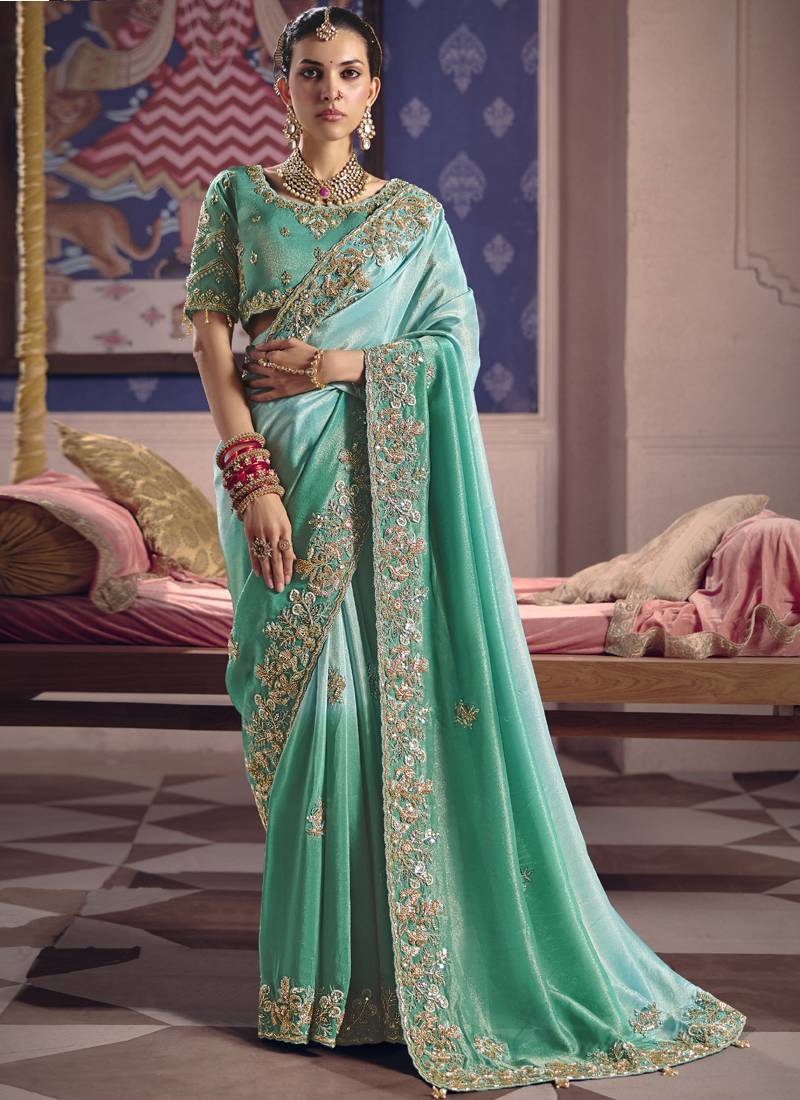 Turquoise silk embroidered wedding wear saree