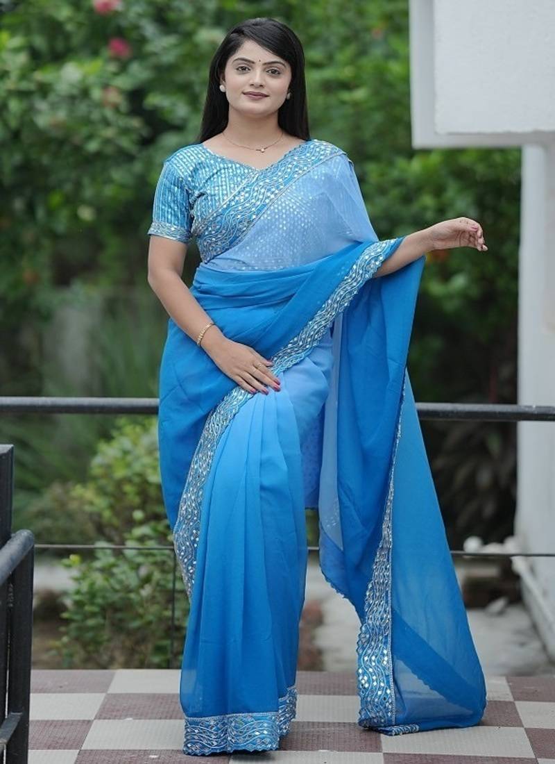 Blue Color Embroidered Lace Border with Real Mirror Work Faux Georgatte Saree