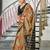 Beige ikkat print soft pure cotton saree with blouse.