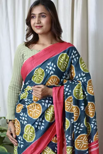 Teal blue ikkat print mulmul cotton saree with blouse.