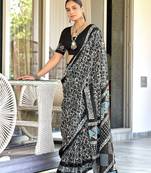 Black batik print mulmul cotton saree with blouse.