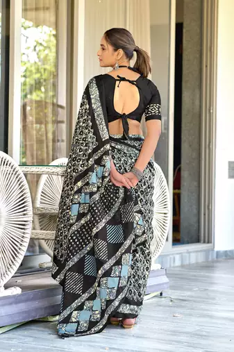 Black batik print mulmul cotton saree with blouse.
