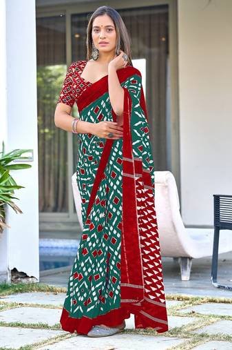Teal green ikkat print mulmul cotton saree with blouse.
