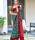 Teal green ikkat print mulmul cotton saree with blouse.
