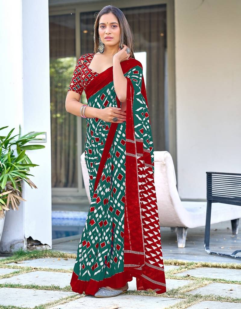 Teal green ikkat print mulmul cotton saree with blouse.