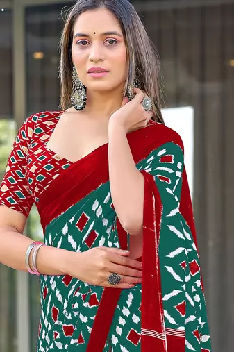 Teal green ikkat print mulmul cotton saree with blouse.