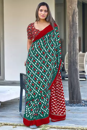 Teal green ikkat print mulmul cotton saree with blouse.