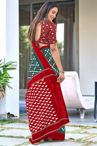 Teal green ikkat print mulmul cotton saree with blouse.