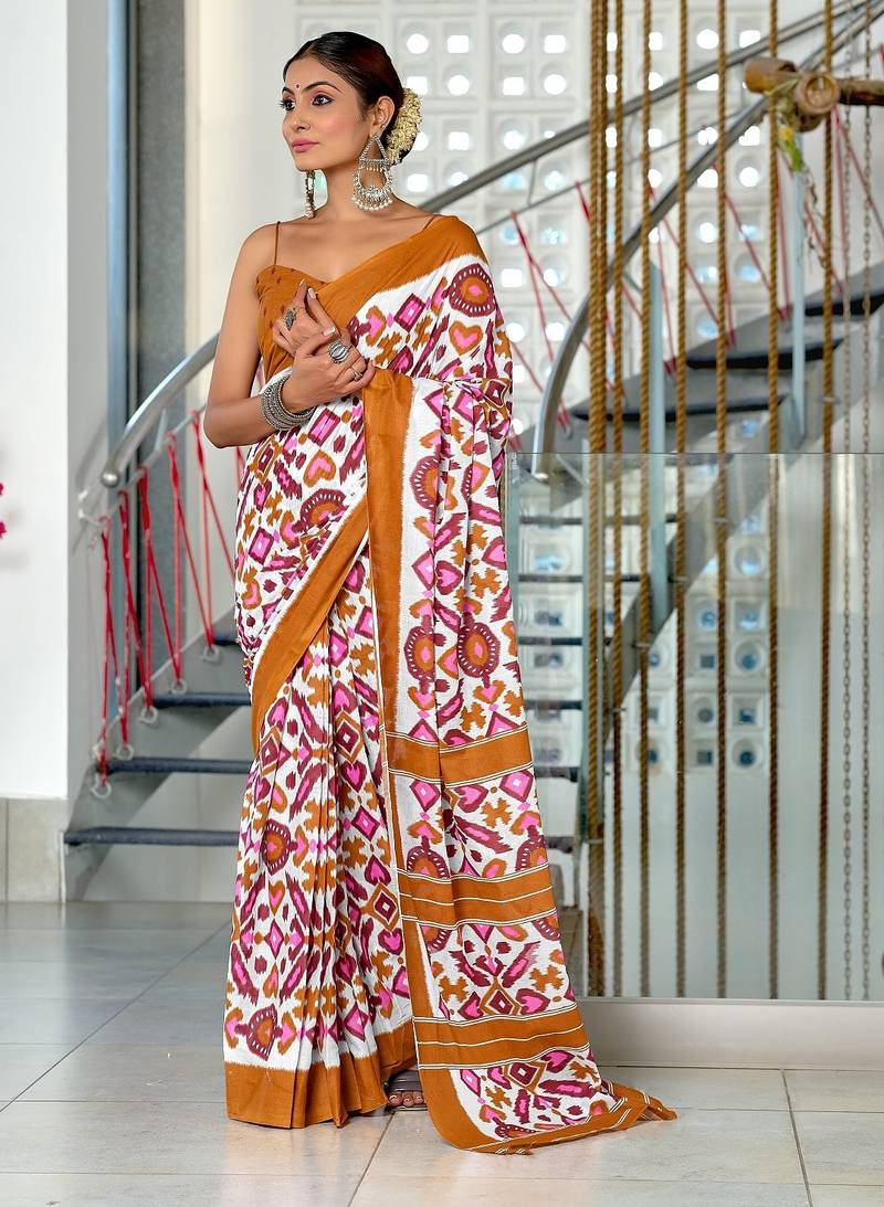 Mustard ikkat print mulmul cotton saree with blouse.