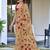 Beige floral print mulmul cotton saree with blouse.