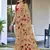 Beige floral print mulmul cotton saree with blouse.
