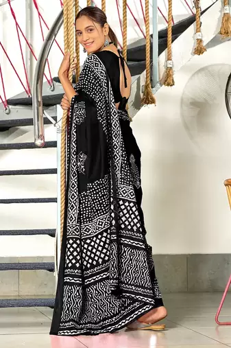 Black batik print mulmul cotton saree with blouse.