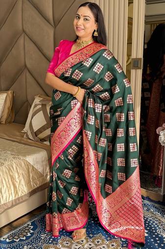 Dark green silk banarasi woven saree with unstitched blouse piece