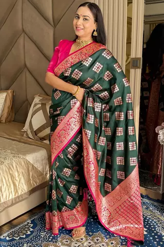Dark green silk banarasi woven saree with unstitched blouse piece