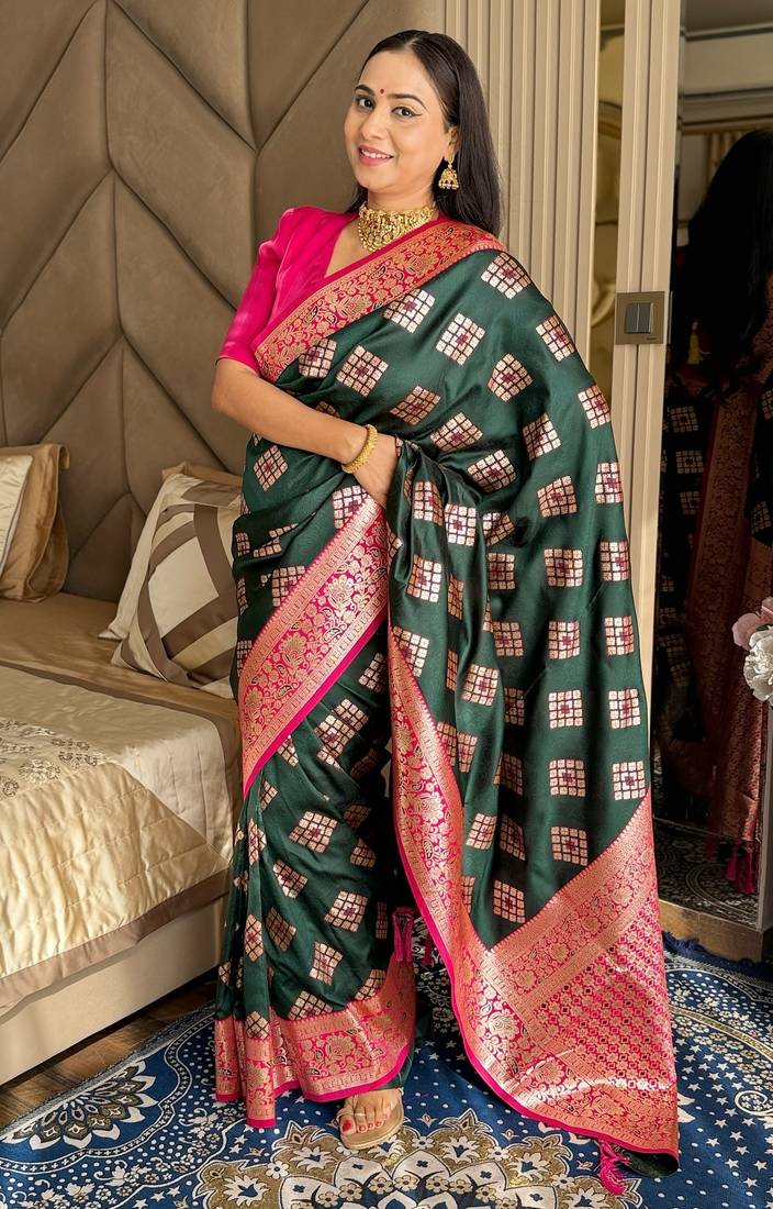 Dark green silk banarasi woven saree with unstitched blouse piece