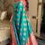 Turquoise silk banarasi woven saree with unstitched blouse piece