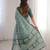 Green blocked printed, paisley soft pure cotton saree with blouse.