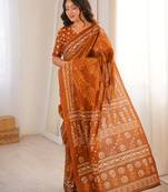 Mustard blocked printed, floral print soft pure cotton saree with blouse.