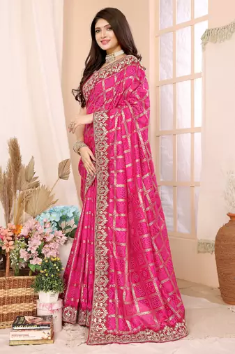 Pink bandhani printed vichitra silk saree with embroidered border