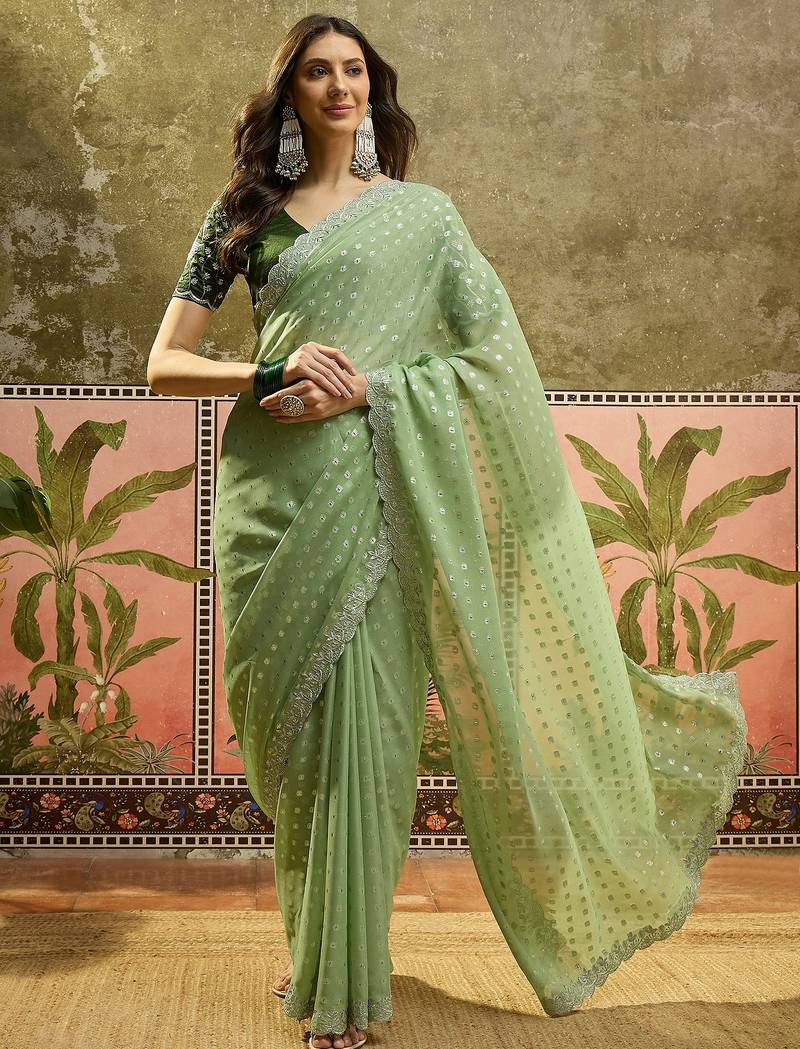 Green georgette embroidered saree with unstitched blouse piece