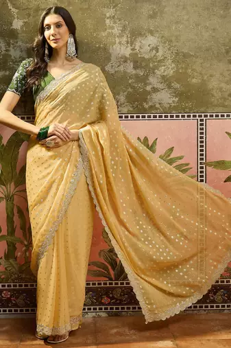 Yellow georgette embroidered saree with unstitched blouse piece