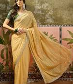 Yellow georgette embroidered saree with unstitched blouse piece