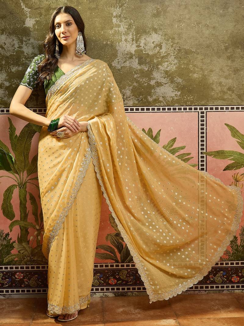 Yellow georgette embroidered saree with unstitched blouse piece