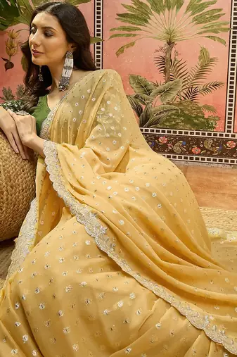 Yellow georgette embroidered saree with unstitched blouse piece