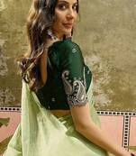 Green chiffon embroidered saree with unstitched blouse piece