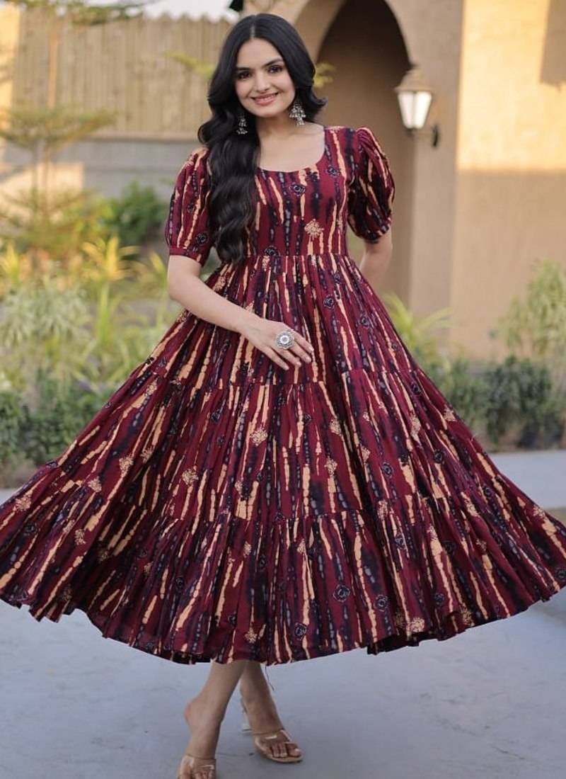 Women maroon & gold printed long dress with flared design