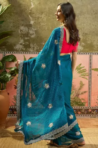 Teal silk blend chiffon embellished saree with unstitched blouse piece