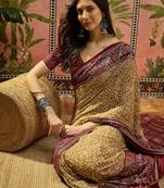 Beige georgette bandhni saree with unstitched blouse piece