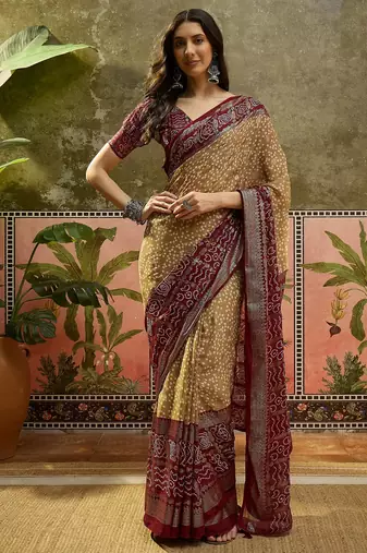 Beige georgette bandhni saree with unstitched blouse piece