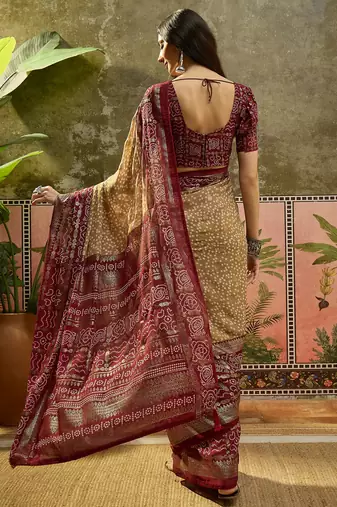Beige georgette bandhni saree with unstitched blouse piece