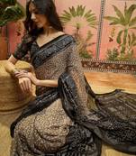 Grey georgette bandhni saree with unstitched blouse piece