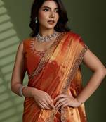 Rust silk blend chiffon embellished saree with unstitched blouse piece