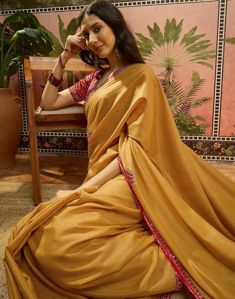 Mustard chiffon bandhni saree with unstitched blouse piece