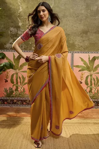 Mustard chiffon bandhni saree with unstitched blouse piece